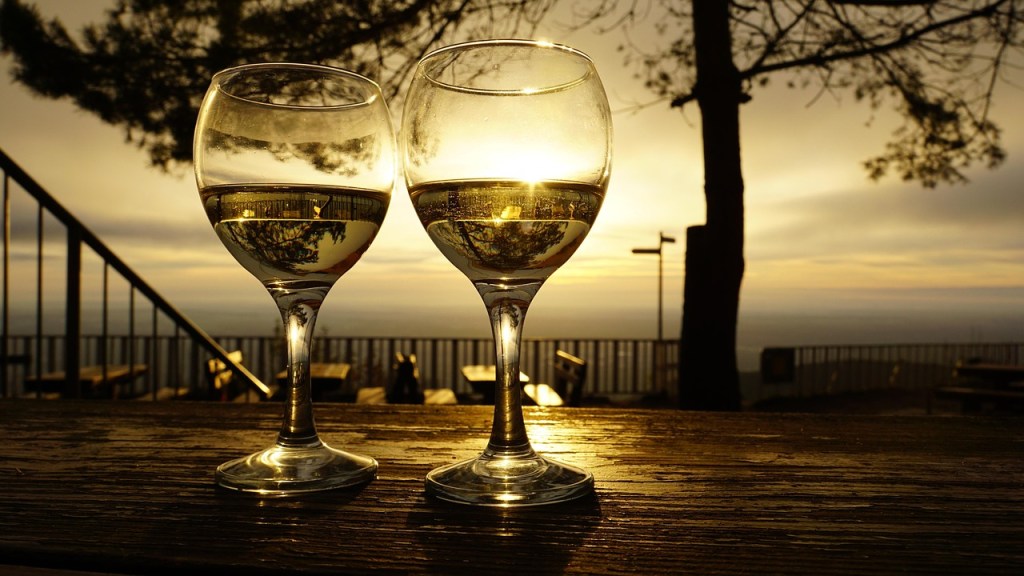 Wine Glasses outside on a table at sunset